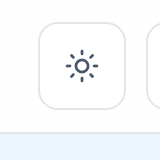 The sun and moon dark-mode toggle button in the top navigation bar
